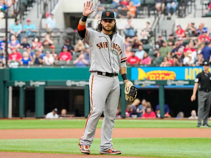 Jun 8, 2021; Arlington, Texas, USA; San Francisco Giants shortstop Brandon Crawford (35) is recognized as he takes the field for his 1,326th appearance at shortstop, setting a new record for the Giants, during the first inning against the Texas Rangers at Globe Life Field.